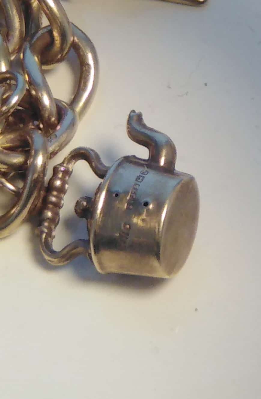 1963 9ct Gold Charm Bracelet and 10 Charms 32.8g
